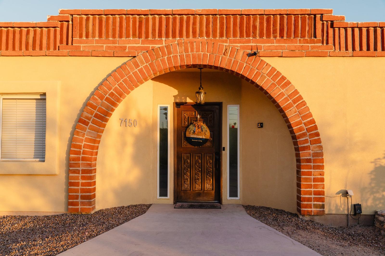 House Two brick arch entryway