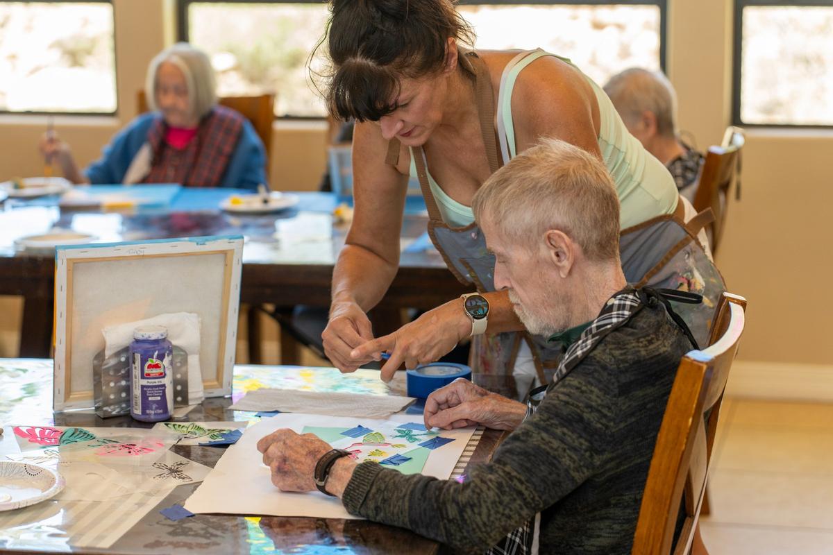 Residents enjoying a painting activity at Hacienda De Luna