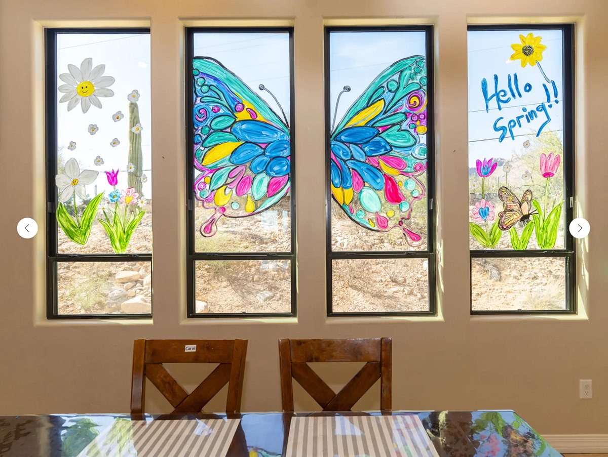 Colorful spring window artwork at Hacienda De Luna